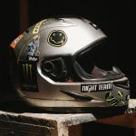 a helmet sitting on top of a wooden block